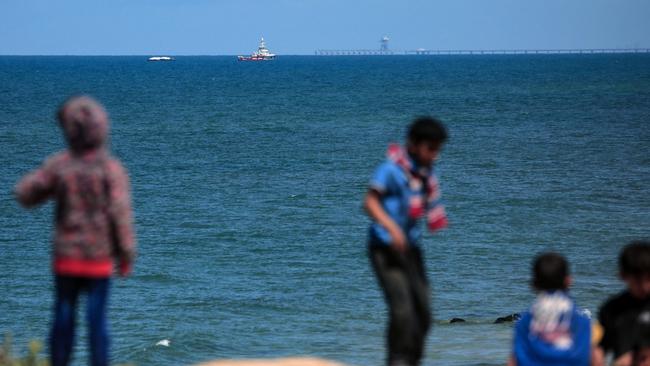 Palestinian children gather on the beaches, where Hamas says drownings occur after aid packages are air-dropped into the sea. Picture: AFP