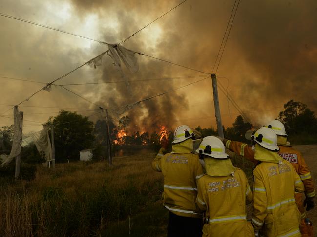 Fire crews watch on as the blaze approaches the Bilpin Fruit Bowl. Photo Jeremy Piper