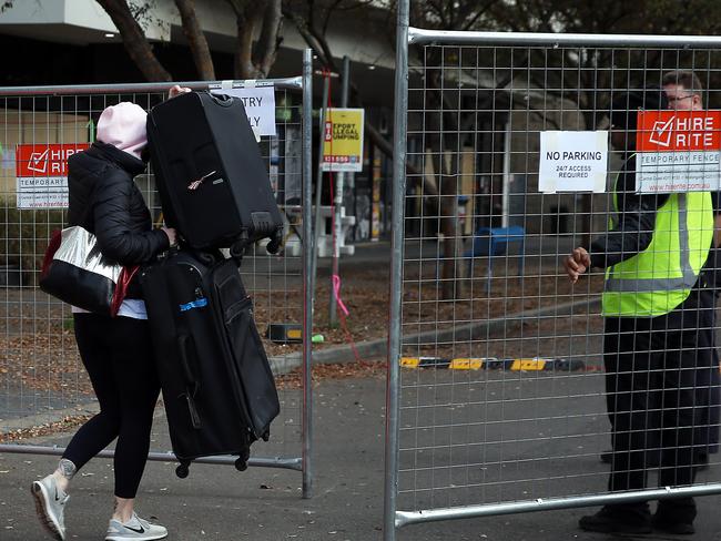 Residents removing their belongings from the apartment complex on June 23. Picture: Jane Dempster