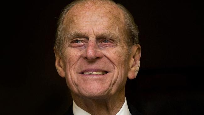 (FILES) In this file photo taken on November 23, 2011 Britain's Prince Philip, the Duke of Edinburgh, smiles as he visits the Admiralty Board and Admiralty House in central London, on November 23, 2011, where he formally received Letters Patent as the holder of the title and office of Lord High Admiral. - Queen Elizabeth II's 99-year-old husband Prince Philip, who was recently hospitalised and underwent a successful heart procedure, died on April 9, 2021, Buckingham Palace announced. (Photo by CARL COURT / AFP)