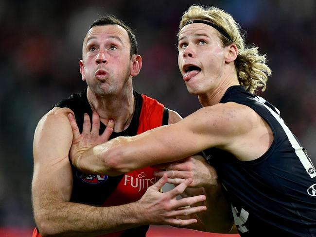 MELBOURNE, AUSTRALIA - JUNE 09: Todd Goldstein of the Bombers and Tom De Koning of the Blues compete in the ruck during the round 13 AFL match between Essendon Bombers and Carlton Blues at Melbourne Cricket Ground, on June 09, 2024, in Melbourne, Australia. (Photo by Josh Chadwick/Getty Images)