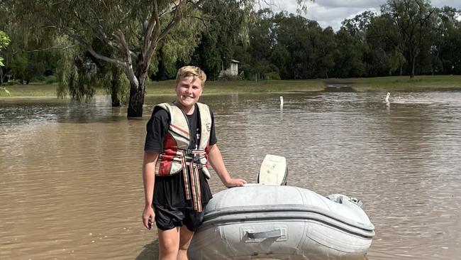 Barrett Haager behind his grandmother’s home on James Street during 2022 floods in Dalby Picture: Emily Devon