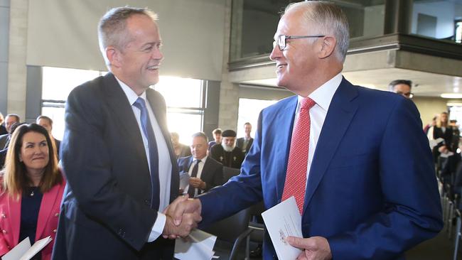 Opposition Leader Bill Shorten and PM Malcolm Turnbull shake hands at the Ecumenical Service for the commencement of the 2018 parliamentary year at the Australian Centre for Christianity and Culture in Canberra. Photo: Kym Smith