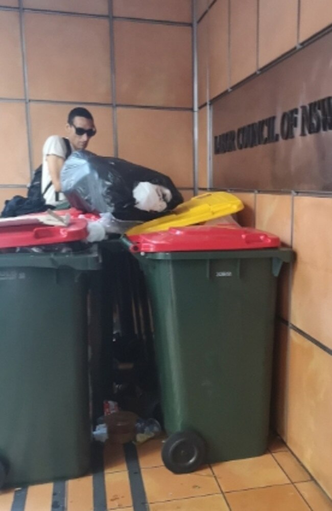 Police are investigating an unidentified male who has been filmed going through garbage bins outside Labor Party offices in Sydney. Supplied