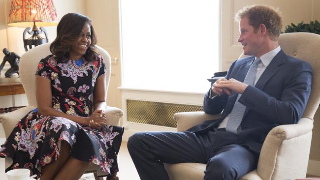 LONDON, ENGLAND - JUNE 16: In this handout photo provided by The White House, US First Lady Michelle Obama meets Prince Harry at Kensington Palace on June 16, 2015 in London, England. The US First Lady is travelling with her daughters, Malia and Sasha and her mother, Mrs. Marian Robinson, to continue a global tour promoting her 'Let Girls Learn Initiative'. The event at the school was to discuss how the UK and USA are working together to expand girl's education around the world. (Photo by Amanda Lucidon/The White House via Getty Images)