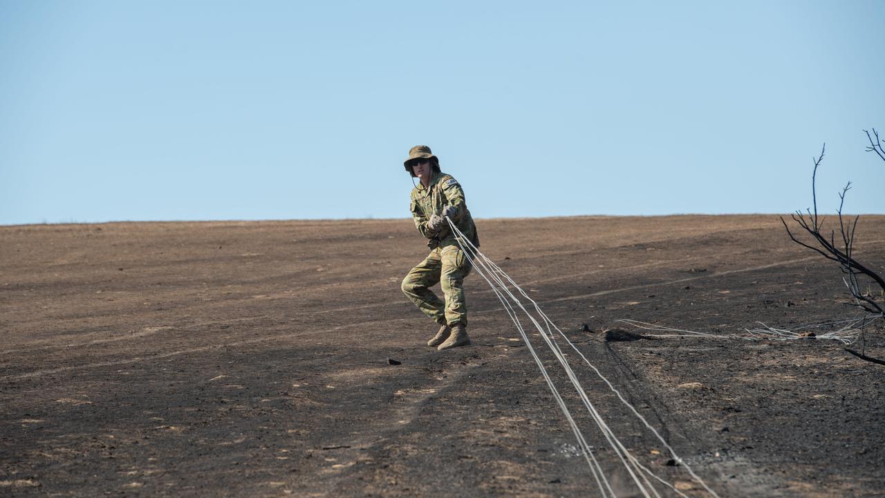 Army Reservists help replace stock fencing on Josh Graham's property. Picture: Brad Fleet