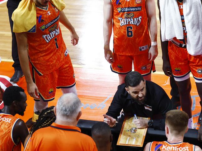 Taipans coach Adam Forde (centre) speaks with his players during a time out at the National Basketball League (NBL) match between the Cairns Taipans and the Sydney Kings, held at the Cairns Convention Centre. Picture: Brendan Radke