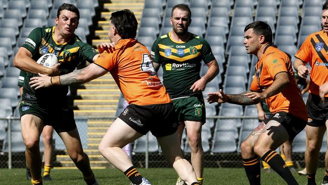 Mittagong’s Timothy Townsend takes on Jaydn Phillips. Picture: John Appleyard