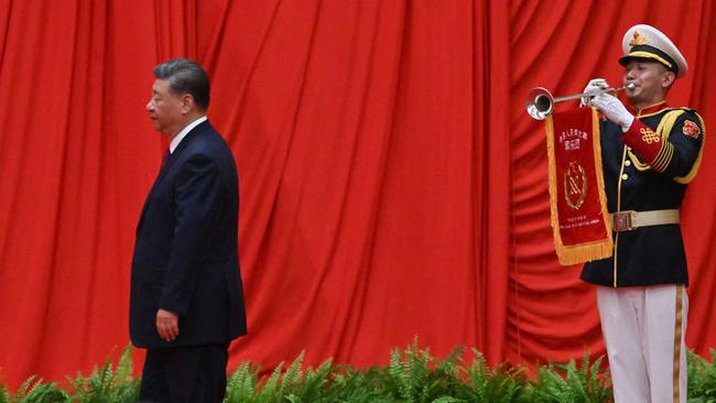 China’s President Xi Jinping walks to the podium during a reception on the eve of National Day at the Great Hall of the People in Beijing. Picture: AFP