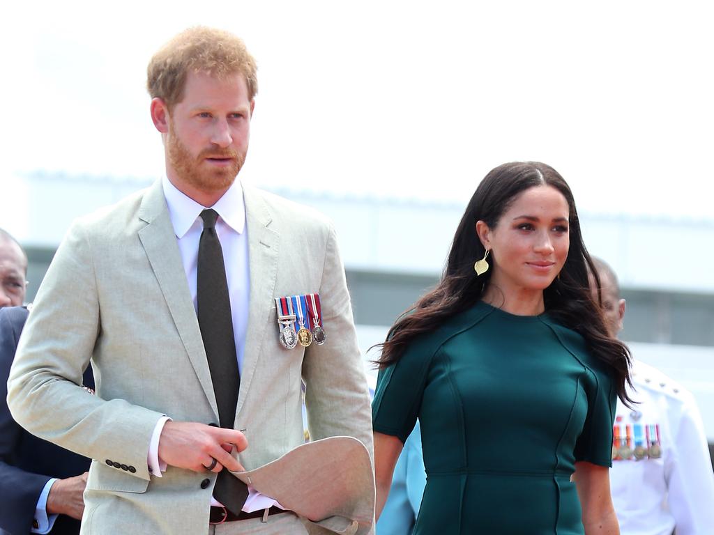The Duke and Duchess of Sussex Prince Harry and Meghan take part in a traditional fijian ceremony at Nadi Airport in Fiji to . Picture: Nathan Edwards