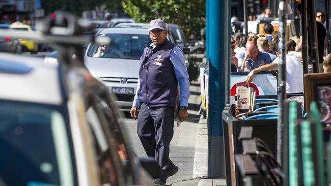 A Stonnington parking officer in action along Chapel St in Windsor before the coronavirus pandemic. Picture: Eugene Hyland