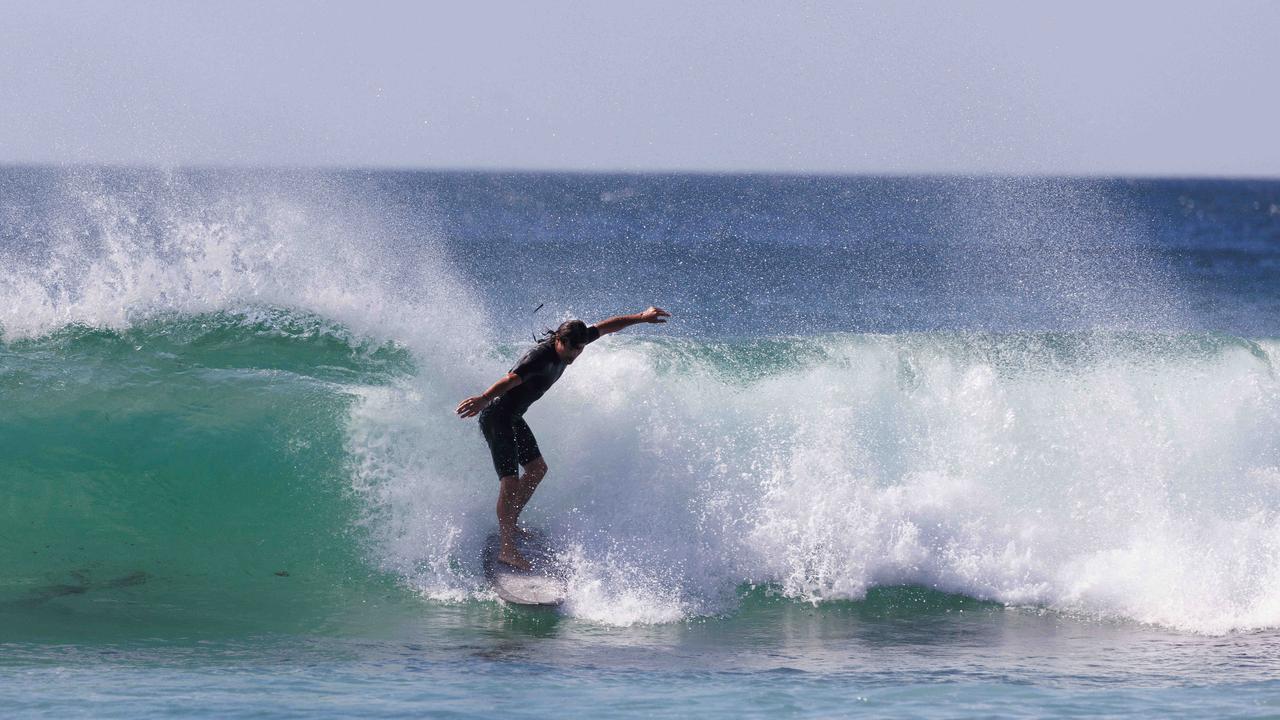 Surfers enjoyed a balmy day at Bondi Beach on Sunday but from Monday, temperatures will decrease drastically. Picture: NCA NewsWire / David Swift