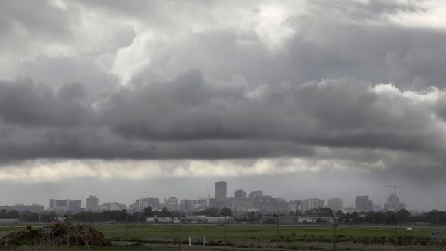 Rain clouds over the city from Adelaide airport. Picture: AAP Image/Dean Martin