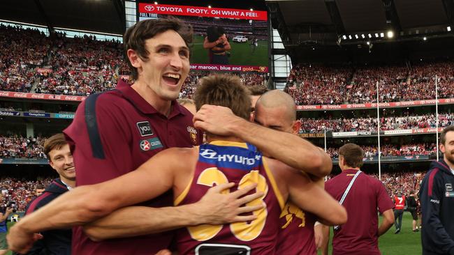 Oscar McInerney celebrates with teammates after Brisbane Lions win the  AFL Grand Final, defeating the Sydney Swans at the MCG. Picture Lachie Millard