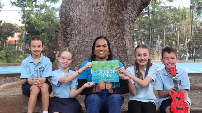 ILF publishing projects editor Cindy Manfong with children from Rozelle Public School in Sydney who have signed up for this year’s Busking for Change. Photo credit: ILF Supplied