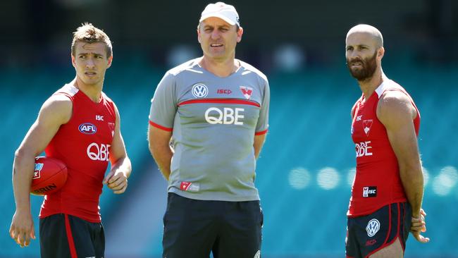 John Longmire speaks to co-captains Kieren Jack and Jarrad McVeigh.