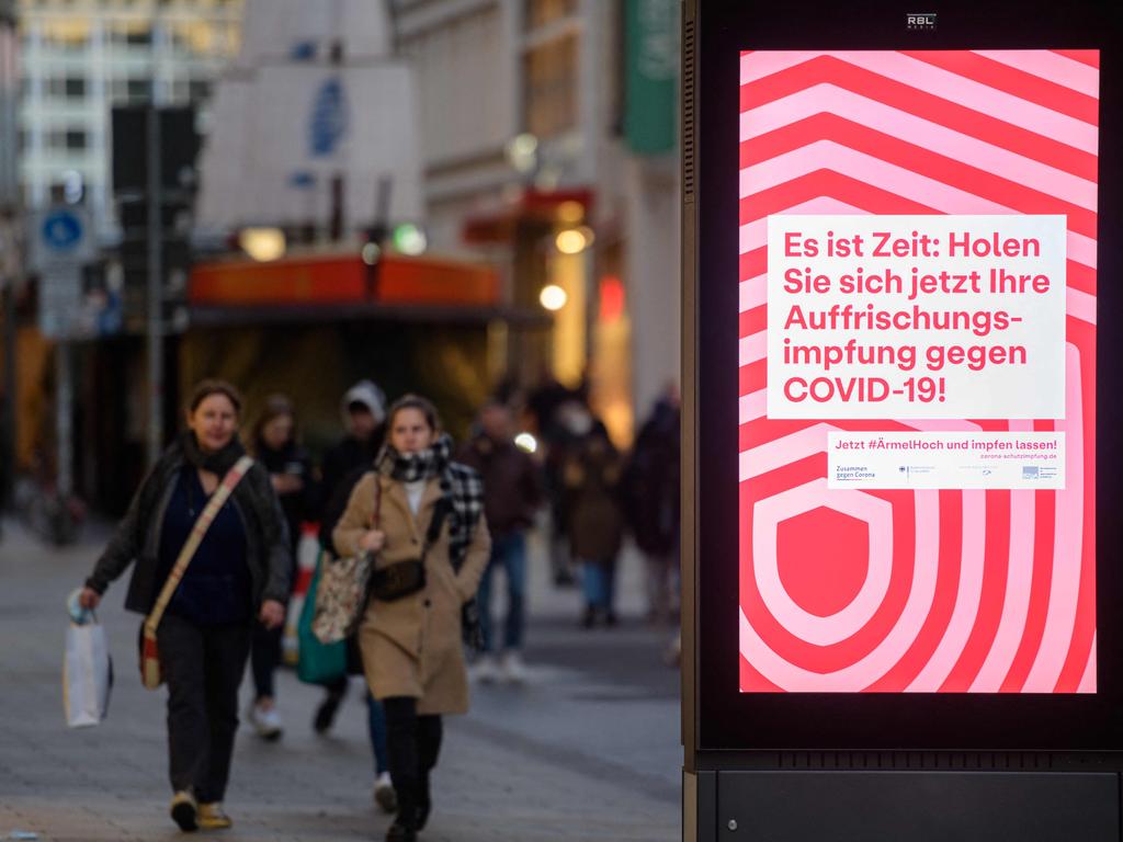 An ad calls for people to get their booster in Leipzig, Germany. Picture: Stringer/AFP