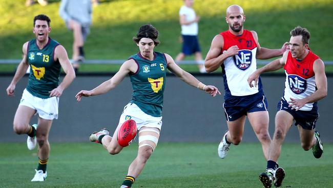 Casey recruit Jay Lockhart takes a kick for Tasmania in last year’s representative match against the NEAFL.