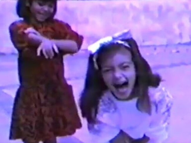 Kim and her sister Kourtney together in a home video which is featured in Kanye’s video montage.