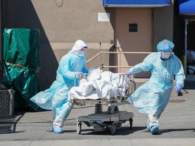 Bodies are moved to a refrigeration truck serving as a temporary morgue in Brooklyn. Picture: AFP