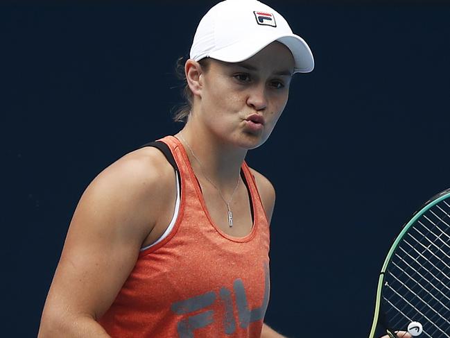 MELBOURNE, AUSTRALIA - FEBRUARY 01: Ashleigh Barty of Australia reacts during a practice session at Melbourne Park on February 01, 2021 in Melbourne, Australia. Melbourne Park is now out of lockdown mode following the end of the player and support staff quarantine period after arriving in Melbourne on International flights and they can resume a regular practice schedule ahead of lead in tournaments before the 2021 Australian Open. (Photo by Daniel Pockett/Getty Images)