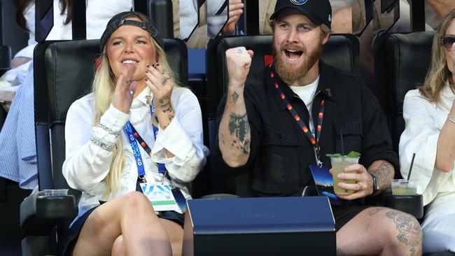 Tones and I with husband Jimmy Bedford watched most of the Men's Final. Picture: Tennis Australia / FIONA HAMILTON