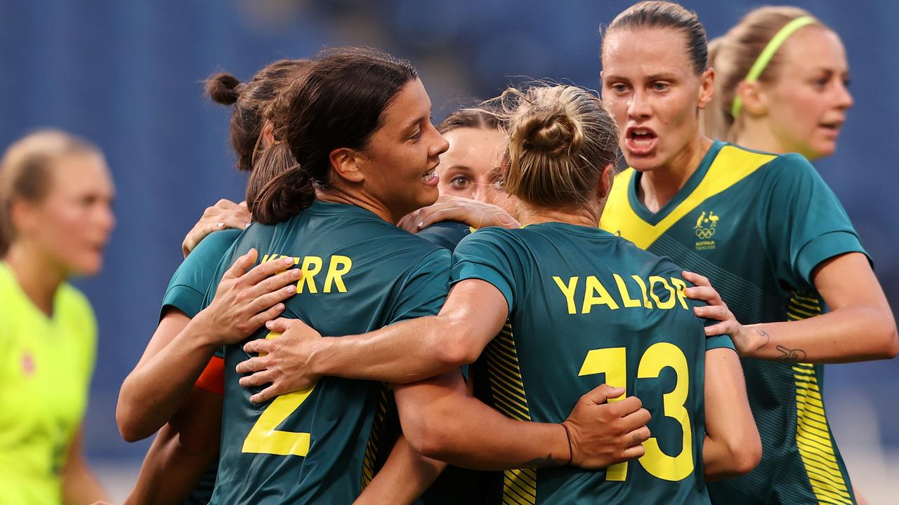 SAITAMA, JAPAN - JULY 24: Sam Kerr #2 of Team Australia celebrates with team mates after scoring their side's second goal during the Women's First Round Group G match between Sweden and Australia on day one of the Tokyo 2020 Olympic Games at Saitama Stadium on July 24, 2021 in Saitama, Japan. (Photo by Francois Nel/Getty Images)