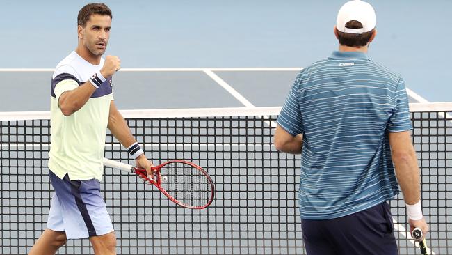 TENNIS - Adelaide International Tennis, Memorial Drive. Doubles Final. Ivan Dodig and Filip Polasek vs Maximo Gonzalez and Fabrice Martin. Maximo Gonzalez fist pumps to his partner Fabrice Martin after taking the first set in a tie-breaker Picture SARAH REED