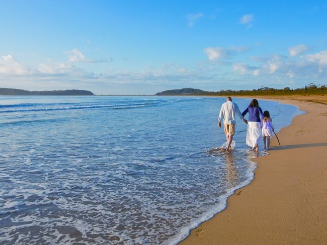 Family walk along Broulee Beach, Eurobodalla, South Coast