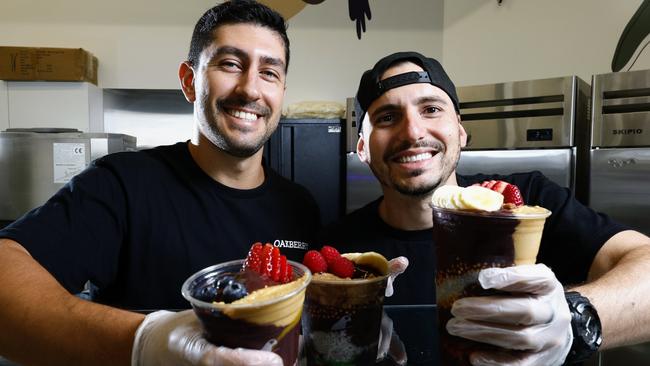 Oakberry Acai is a new health food eatery at the corner of the Cairns Esplanade and Shields St, exclusively offering acai bowls and smoothies. Eduardo Cavalcante and store manager Matheus Ramos prepare a variety of acai bowls, which have proved popular with health conscious locals and tourists. Picture: Brendan Radke