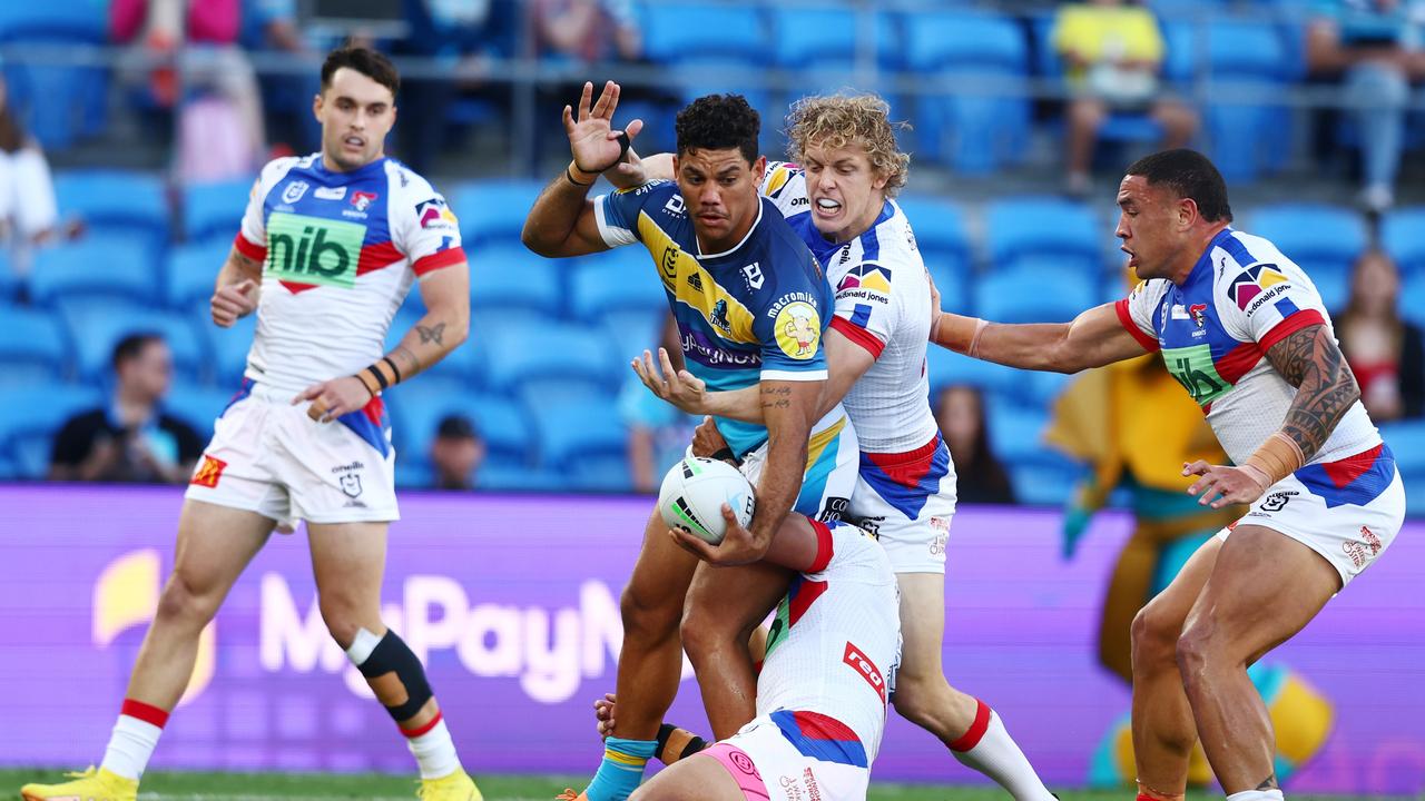 GOLD COAST, AUSTRALIA - AUGUST 28: Brian Kelly of the Titans is tackled during the round 24 NRL match between the Gold Coast Titans and the Newcastle Knights at Cbus Super Stadium, on August 28, 2022, in Gold Coast, Australia. (Photo by Chris Hyde/Getty Images)