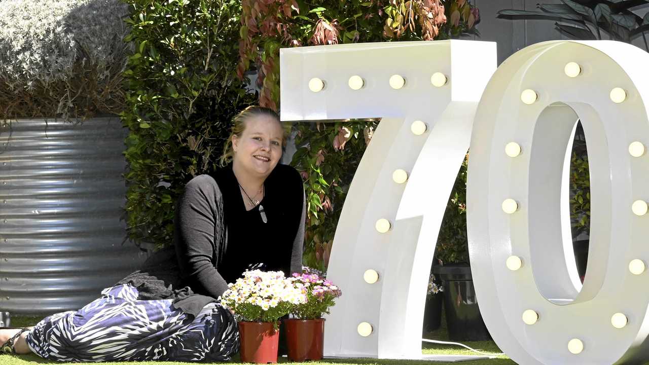 DEBUT GARDENER: First-time entrant in The Chronicle Garden Competition Karissa Lawrence is excited about entering her garden at Sunray Motor Inn in Wilsonton in this year's competition for the 70th Carnival of Flowers. Picture: Bev Lacey