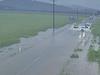 Man in 70s rescued from car stranded in floodwaters