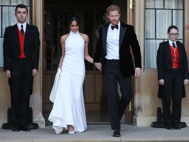 Prince Harry and Meghan Markle after their wedding leaving for an evening reception at Frogmore House, hosted by the Prince of Wales in Windsor. Picture: Getty Images