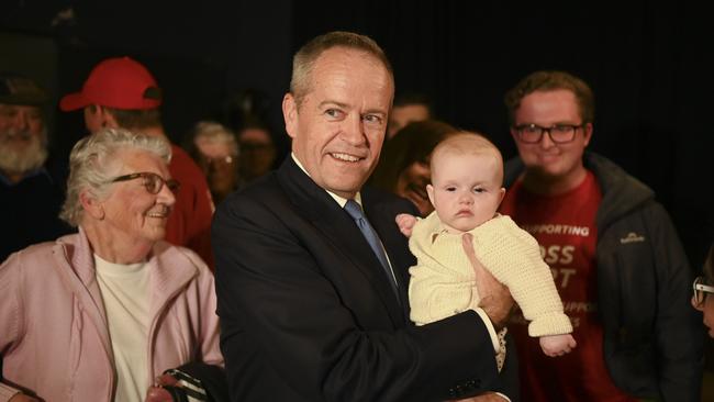 Bill Shorten holds baby Phoebe in Tasmania. Picture: Lukas Coch