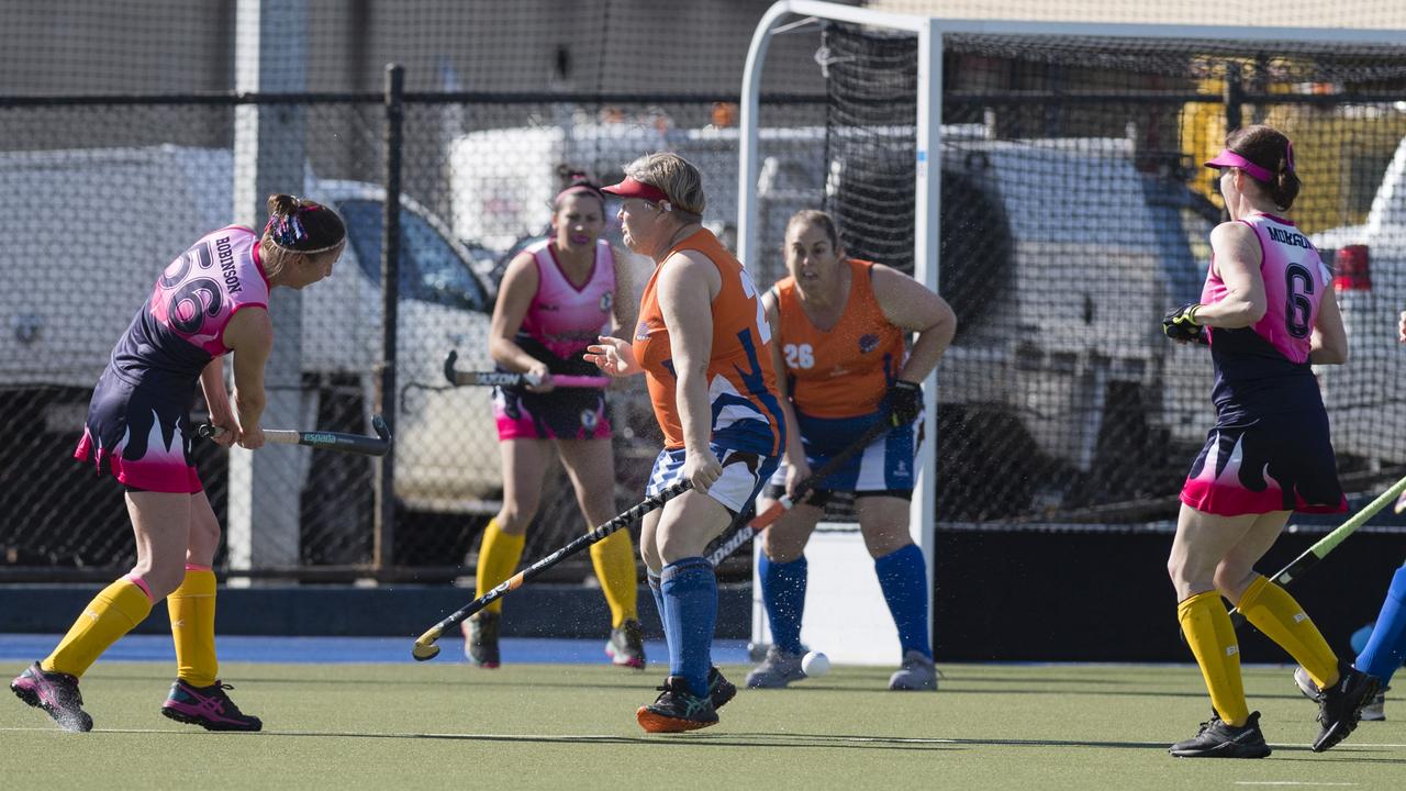 Latitia Robinson (left) shoots for Toowoomba 2 against Maryborough 1.