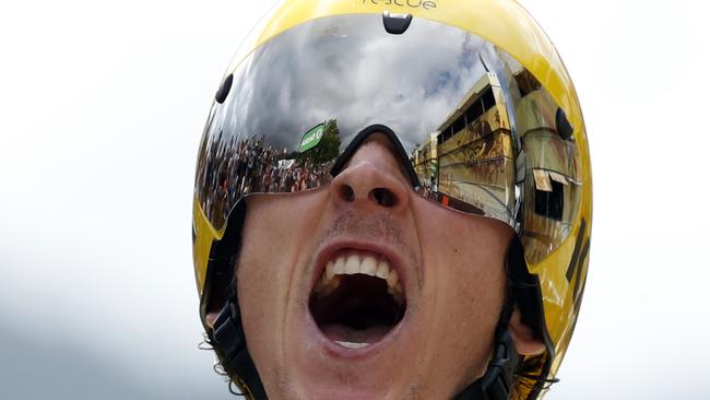 Britain's Geraint Thomas, wearing the overall leader's yellow jersey reacts as he crosses the finish line during the twentieth stage of the Tour de France cycling race, an individual time trial over 31 kilometers (19.3 miles) with start in Saint-Pee-sur-Nivelle and finish in Espelette, France, Saturday, July 28, 2018. (AP Photo/Christophe Ena)