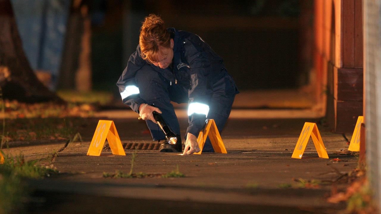 Forensic investigators comb the area near Condello’s Brighton East home.