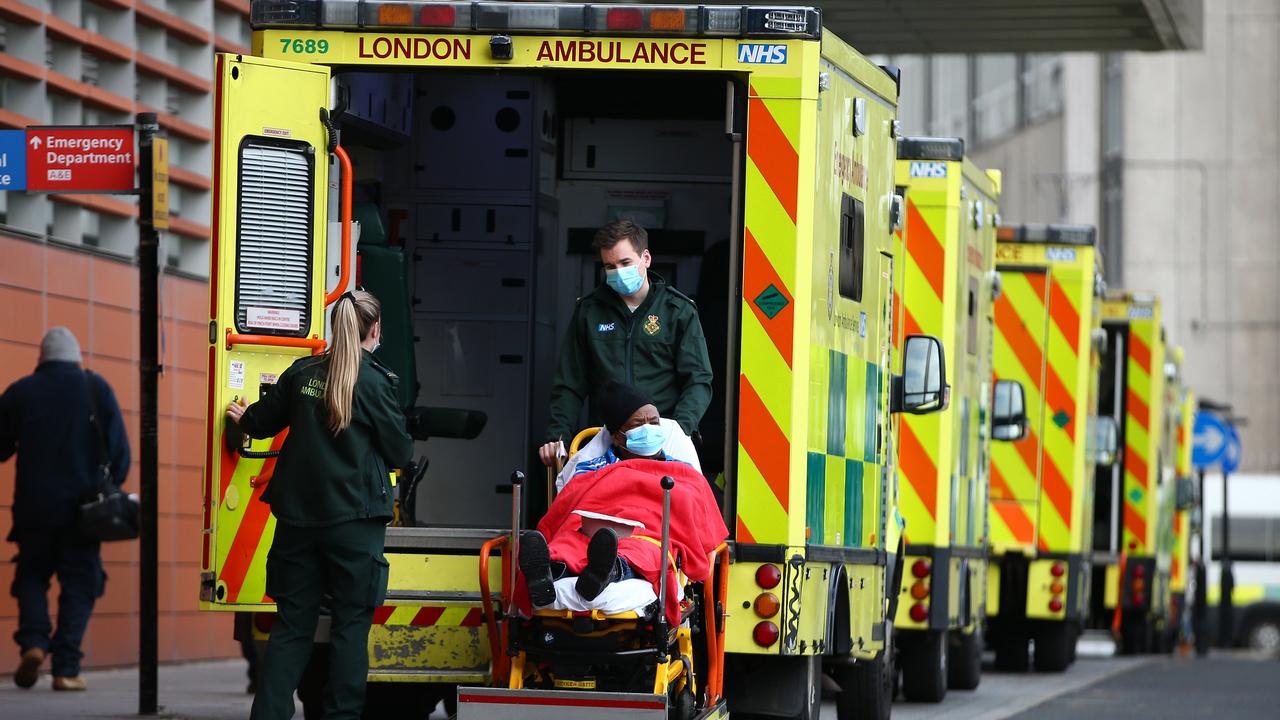 A patient is lowered out of an ambulance at The Royal London Hospital on December 30. The health system under huge pressure as new cases of COVID-19 surpassed 50,000 in the UK for one day yesterday. Picture: Hollie Adams/Getty Images