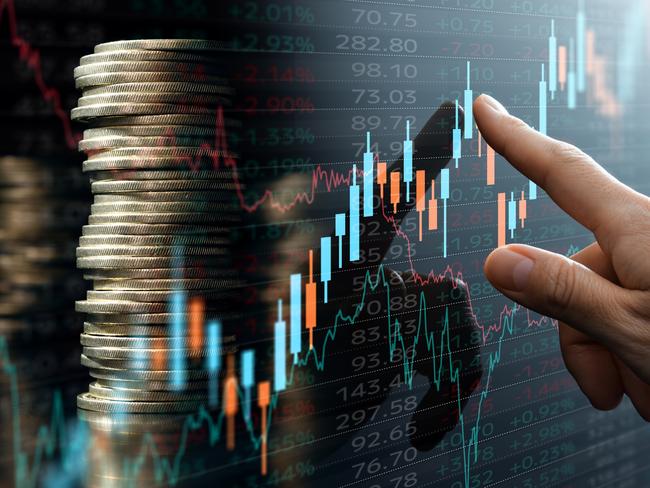 Analyst pointing candlestick chart; investing compound interest generic