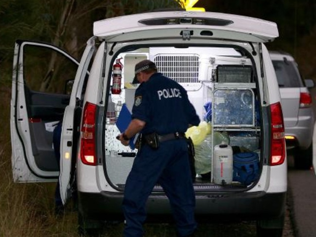 Police investigators at the scene of Mark Easter’s murder. Picture: Troy Snook