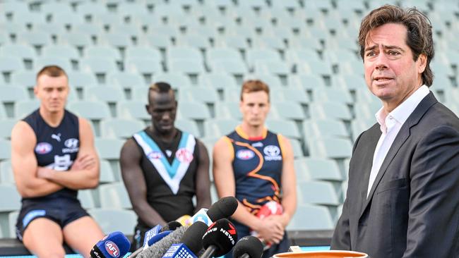 ADELAIDE, AUSTRALIA - NewsWire Photos APRIL 12, 2023: Carlton captain Patrick Cripps, Port Adelaide player Aliir Aliir and Adelaide Crows captain Jordan Dawson watch AFL CEO Gillon McLachlan at Adelaide Oval in the lead up to Gather Round Picture: NCA NewsWire / Brenton Edwards