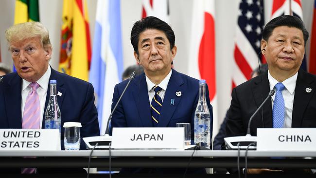 Strategic vision: Shinzo Abe sits between Donald Trump and Xi Jinping during a meeting at the G20 Summit in Osaka in 2019. Picture: AFP