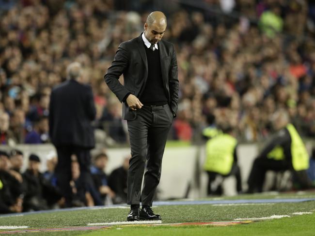 Manchester City's manager Pep Guardiola stands next to the bench during a Champions League, Group C soccer match between Barcelona and Manchester City, at Camp Nou stadium in Barcelona, Wednesday, Oct. 19, 2016. (AP Photo/Manu Fernandez)