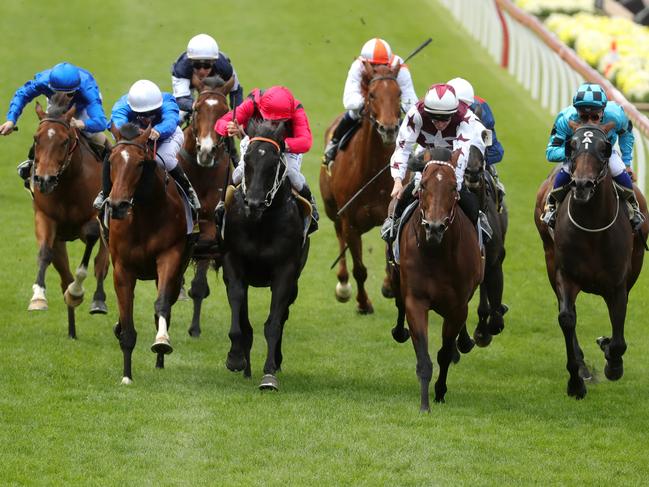 John Allen and Cliff's Edge charge to victory in the Crystal Mile. Picture: AAP