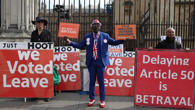 Pro-Brexit activists outside the houses of parliament. Picture: AFP.