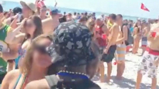 Not just in Australia ... Mobile phone footage from a spring break beach party in the US in March showed a young woman being gang raped as hundreds of partygoers stood by.