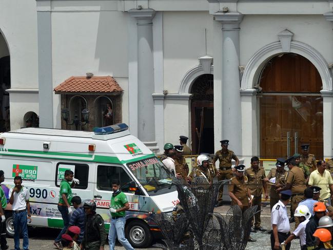 An ambulance is seen outside the church premises with gathered security personnel following a blast at the St. Anthony's Shrine in Kochchikade, Colombo. Picture: AFP