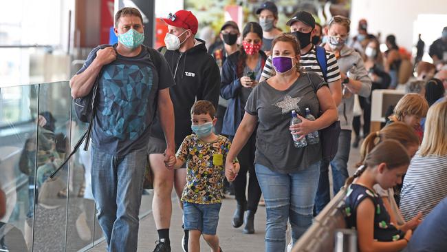 Travellers arrive at Adelaide Airport. The border with Western Australia has reopened. Picture: Tom Huntley