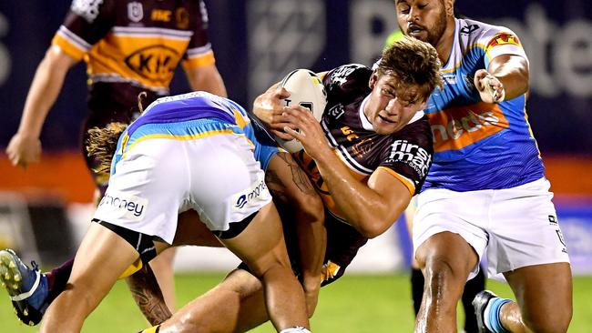 BRISBANE, AUSTRALIA - FEBRUARY 29: Patrick Carrigan of the Broncos is tackled during the NRL Trial match between the Brisbane Broncos and the Gold Coast Titans at Redcliffe on February 29, 2020 in Brisbane, Australia. (Photo by Bradley Kanaris/Getty Images)